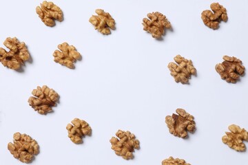 Walnuts on white background, top view