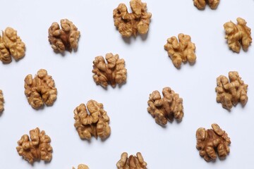 Walnuts on white background, top view