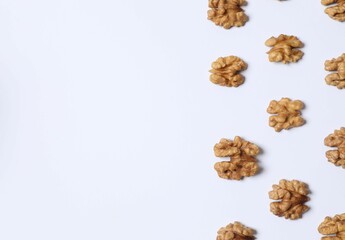 Walnuts on white background, top view