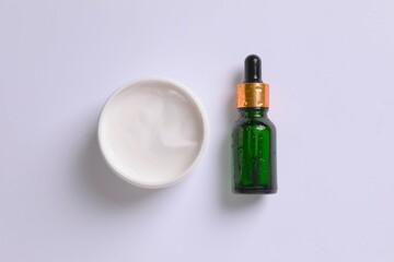 Skin care with cosmetic facial serum with moisturizing cream