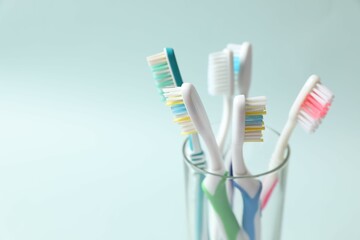 Various toothbrushes on a colored background. Concept of tooth treatment and dental care