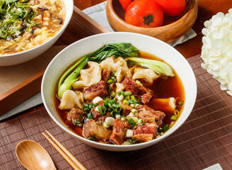Beef Wonton Noodle Soup with meat in bowl isolated on table side view of taiwan food