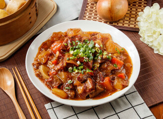 Beef Stew with Vegetables, tomato, green onion, potato, in plated isolated on table side view of taiwan food
