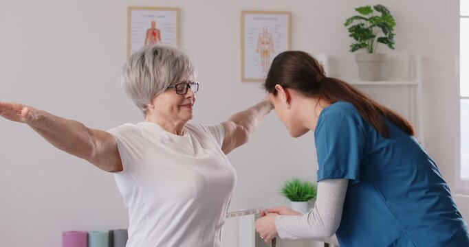 Senior woman, nurse in measure waist using a tape measure, taking body measurements, showing. Old woman during examination, regular clinic check up, doctor monitoring elderly person body weight
