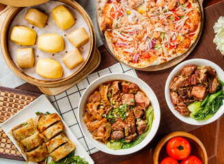 Diverse Taiwanese Cuisine Feast assorted Steamed Mantou Buns, Seafood pizza, Beef Scallion Pancakes, Beef Noodle Soup with Tender Tripe top view isolated on table