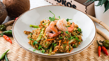 Dinner pilaf with shrimp, sweet pepper, carrots, onions, green peas and microgreens.