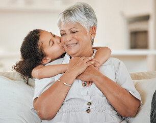 Love, grandmother and grandchild with kiss on sofa with hugging, weekend visit and bonding in home....