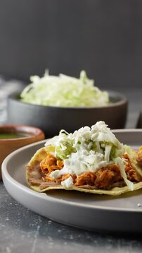 Vertical food video, mexican tostadas served on a gray ceramic plate