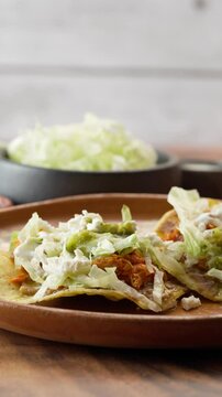 Mexican food on a clay plate, tostadas for the national holidays in Mexico, vertical video