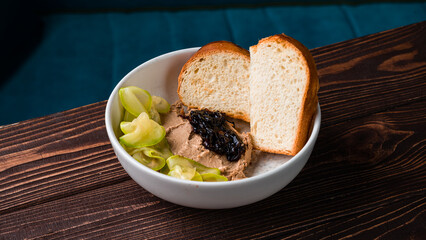Pate with berry jam, zucchini, bread and sauce.