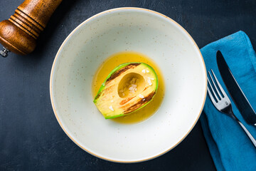 Fried avocado with sea salt and sauce.