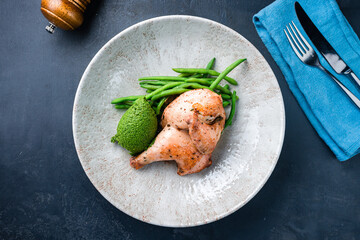 Roasted quail with green beans and spinach puree.