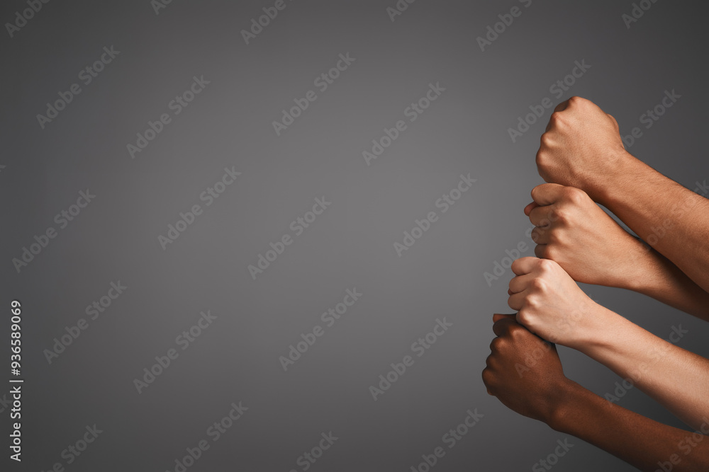 Poster hands, stack and fist with diversity, people and team building on gray studio background. closeup, g