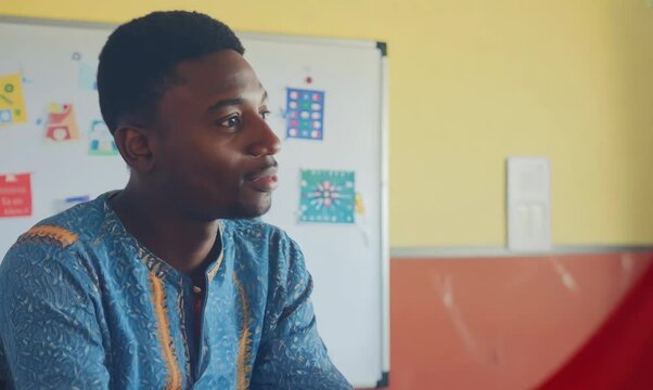Senegalese Man Attending Parent-Teacher Conference