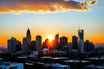 Fototapeta premium Sun setting over a city skyline with modern buildings and people in the distance