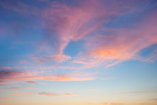 evening sky with blue, white and red clouds