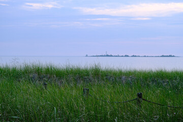 Grass on the bank of  lake, evening, with island view  Lake Huron
