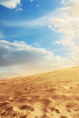 Fototapeta premium Sand Dunes Under Blue Sky With White Clouds