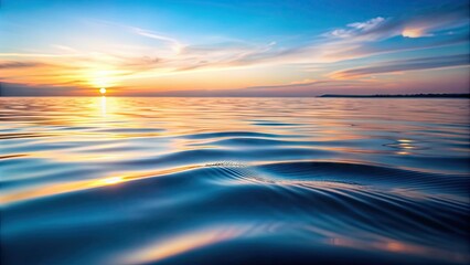 Obraz premium Serene close-up of calm water surface with gentle ripples and subtle wave patterns, reflecting soft natural light and gentle morning ambiance.
