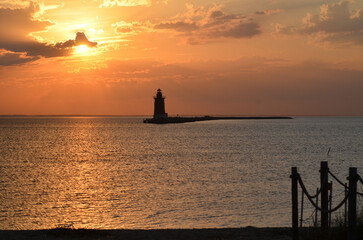 Delaware Breakwater Lighthouse at Cape Henlopen State Park at sunset © Laughing Willows