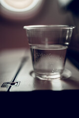 On flight, a glass of water