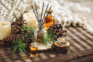 Aromatic home apartment diffuser with the fresh pine fragrance. Spruce, fir tree branches, wooden...