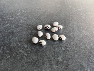 Close-Up of Black-Eyed Peas on Dark Stone Surface