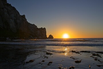 The sun sets over the Pacific in Morro Bay, California