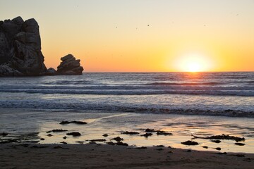 The sun sets over the Pacific in Morro Bay, California