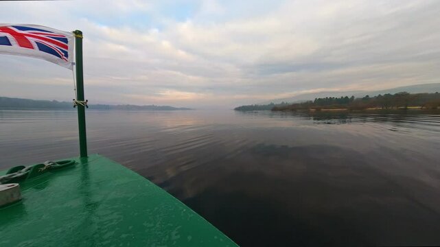 Footage of the red cruise on lake Windermere, Sailing from Bowness to Ambleside. Shot on a misty fogy sunlit day in winter