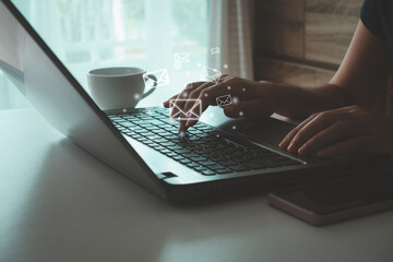 Email marketing and newsletter concept. Businesswoman using computer laptop and sending online...