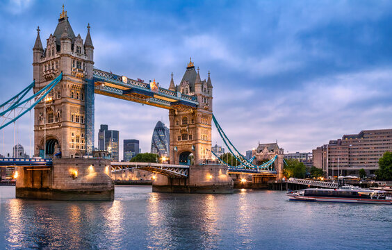 Tower Bridge in London UK at dusk. Tower Bridge is a combined bascule, suspension, and, until 1960, cantilever bridge in London, built between 1886 and 1894.