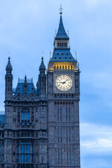 View of Big Ben time clock atop Elizabeth Tower in London, England at dusk