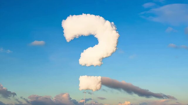 Curious cloud formation resembling a question mark against a clear blue sky at sunset