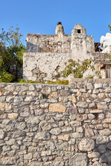 Medieval, architecture and old stone wall with home in city outdoor for travel, journey or tourism to Bodrum in Turkey. House, background and ancient building in town for holiday, vacation and trip