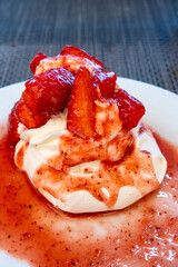 Sweet french dessert, Red strawberry fruit pavlova served in restaurant in Saint-Tropez, France