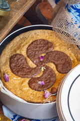 Gateaux tart from Basque Country, brown caramel cheese cake, with different filling, cream, cherry, apricot, walnuts of Perigord, chocolate