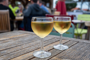 Tasting of Bordeaux white wine, right bank of Gironde Estuary, France. Glasses of white sweet...