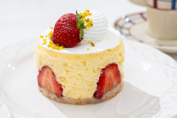 Red fruit sweet dessert cheesecake tart with fresh strawberries in bakery