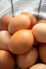 Organic brown chicken eggs from free-range organic farm in basket