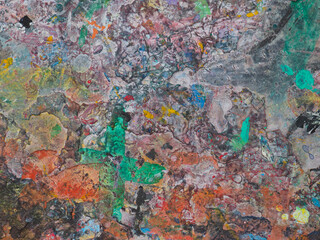 Naklejka premium Paint smeared on the table has colorful patterns. 
