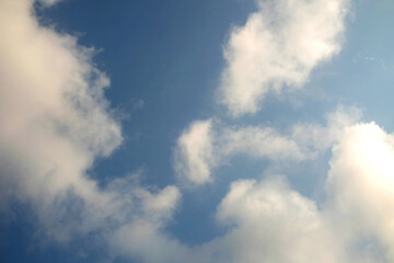 Obraz premium Blue sky background with clouds, Sun rays in the cloudy sky. Nature background.