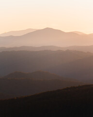 Mountain range at sunset with layers of fading hills 