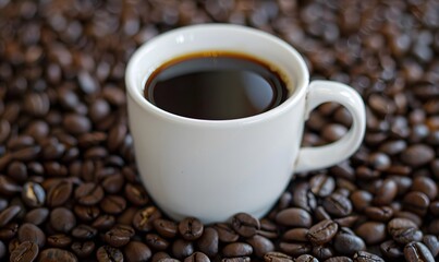 Fototapeta premium Fragrant hot coffee in a white cup with beans spilling roasted 