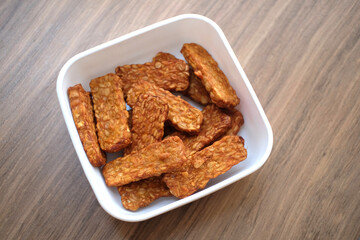 Traditional indonesian culinary food. Tempe Goreng Indonesia Food that is simple and often made at home. Indonesian Street Food. Tempe goreng or fried tempe.
