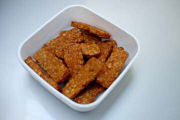 Traditional indonesian culinary food. Tempe Goreng Indonesia Food that is simple and often made at home. Indonesian Street Food. Tempe goreng or fried tempe.