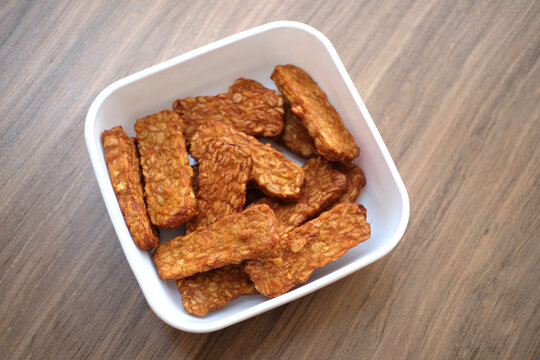 Traditional indonesian culinary food. Tempe Goreng Indonesia Food that is simple and often made at home. Indonesian Street Food. Tempe goreng or fried tempe.