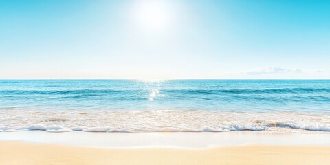 Fototapeta premium A peaceful seaside setting with a bright sun, blue sky, and gentle waves lapping against the sandy coast, creating a relaxing holiday atmosphere