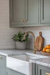 Modern Farmhouse Kitchen with Green Cabinets, Marble Countertops, and Brass Fixtures