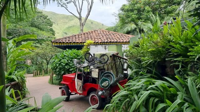 Colombia, Cali, red jeep with cargo of various objects